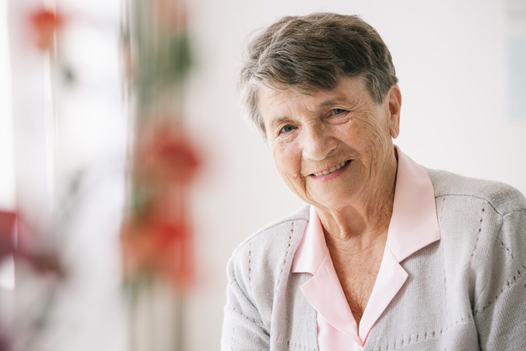 A senior woman smiling